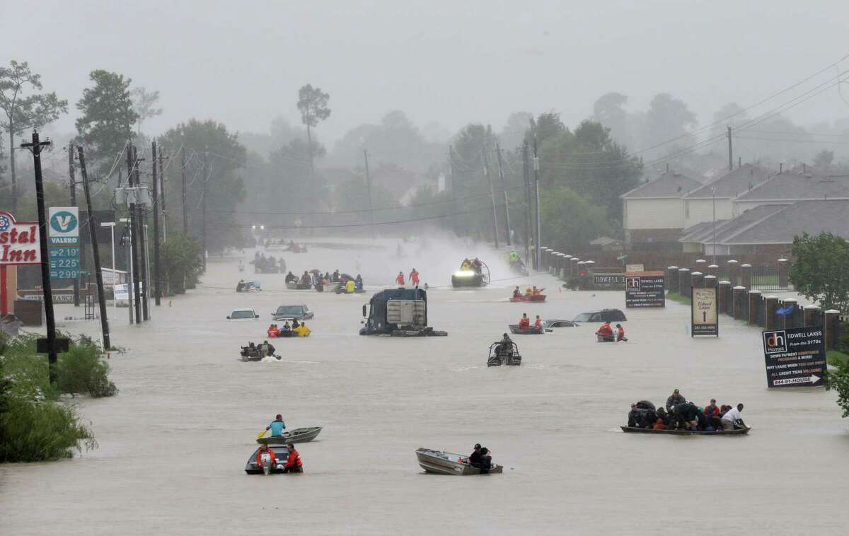 Rescue boats work along Tidwell at the east Sam Houston Tollway helping to evacuate people Monday﻿ during the height of Tropical Storm Harvey. Now, as the floodwaters recede, Houston begins the long slog of recovery.