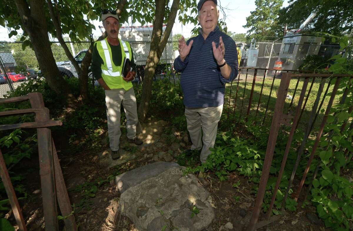 Norwalk Tree Advisory Chairman and The Care of Trees Arborist, Richard Whitehead, and Norwalk Tree Advisory Committee and Norwalk Tree Alliance member, Andrew Strauss, point out the stone monument that marked the second-largest oak tree in the U.S. back in 1951 Saturday, Aug. 26, on Martin Luther King Drive in Norwalk. The Norwalk Tree Alliance stumbled upon the stone monument dedicated by the Daughters of the American Revolution in 1951 to what was purported to be the second-largest oak tree in the United States at the time. The tree is long gone, but the Tree Alliance, Norwalk Tree Advisory Commission and Daughters of the American Revolution plan to rededicate the stone monument this fall.