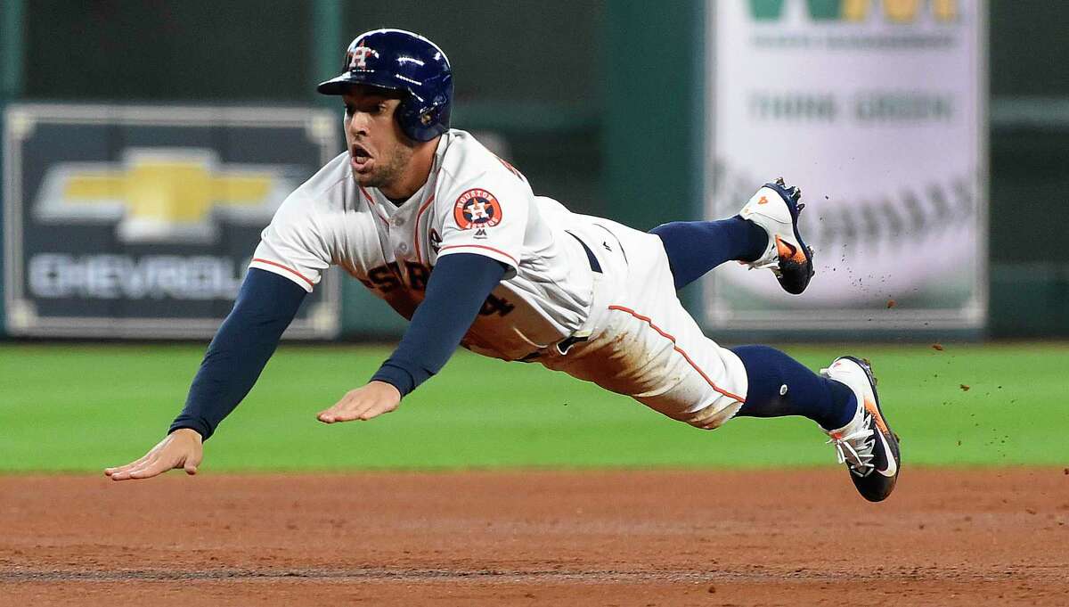 Houston Astros' George Springer slides safely into third on Alex Bregman' single during the first inning of the first game of a baseball doubleheader against the New York Mets, Saturday, Sept. 2, 2017, in Houston. (AP Photo/Eric Christian Smith)