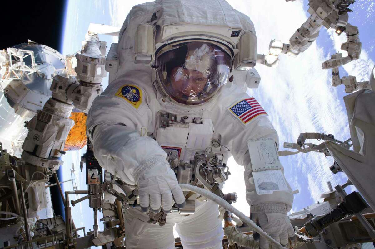 In this Jan. 6, 2017 made available by NASA, astronaut Peggy Whitson works during a spacewalk outside the International Space Station. Whitson and fellow astronaut Shane Kimbrough successfully installed three new adapter plates and hooked up electrical connections for three of the six new lithium-ion batteries on the ISS. (NASA via AP)