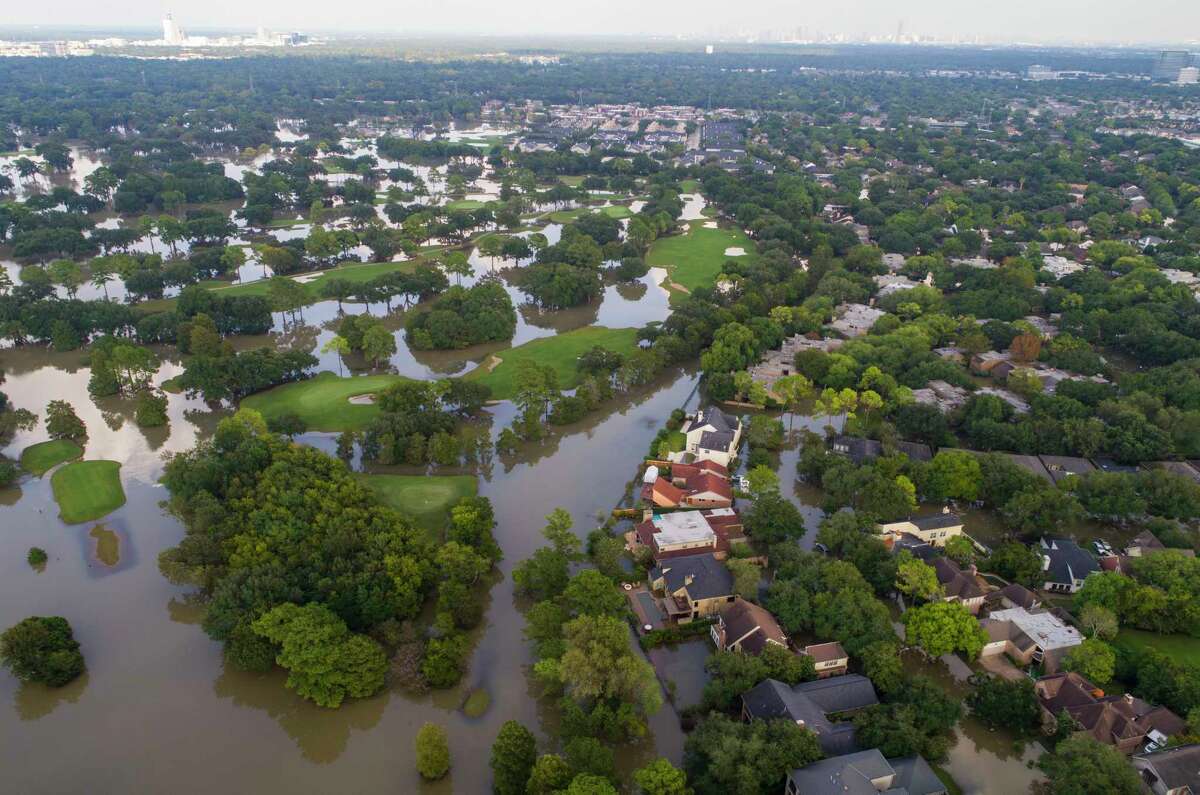 Homes along Lakewood Country Club west of Beltway 8 are inundated with water from the overflowing Buffalo Bayou to the north, Saturday, September 2, 2017, in Houston. Houston mayor Sylvester Turner issued a new mandatory evacuation order Saturday for homes with water in them south of Interstate 10, north of Briar Forest, east of Highway 6 and west of Gessner Rd. As water continues to be released from the Addicks and Barker reservoirs.