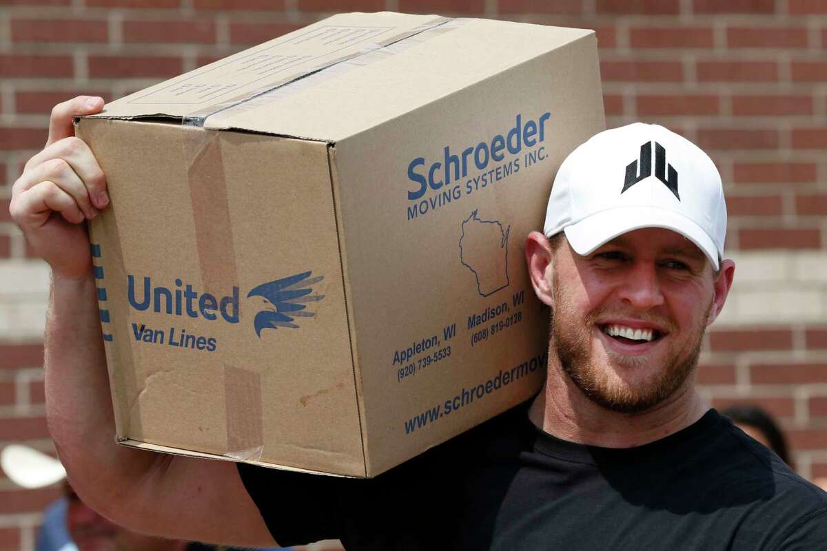 Houston Texans defensive end J.J. Watt holds a box of relief supplies on his shoulder while handing them out to people impacted by Hurricane Harvey on Sunday, Sept. 3, 2017, in Houston. J.J. Watt's Hurricane Harvey Relief Fund, which raised more than $17 million to date to help those affected by the storm.