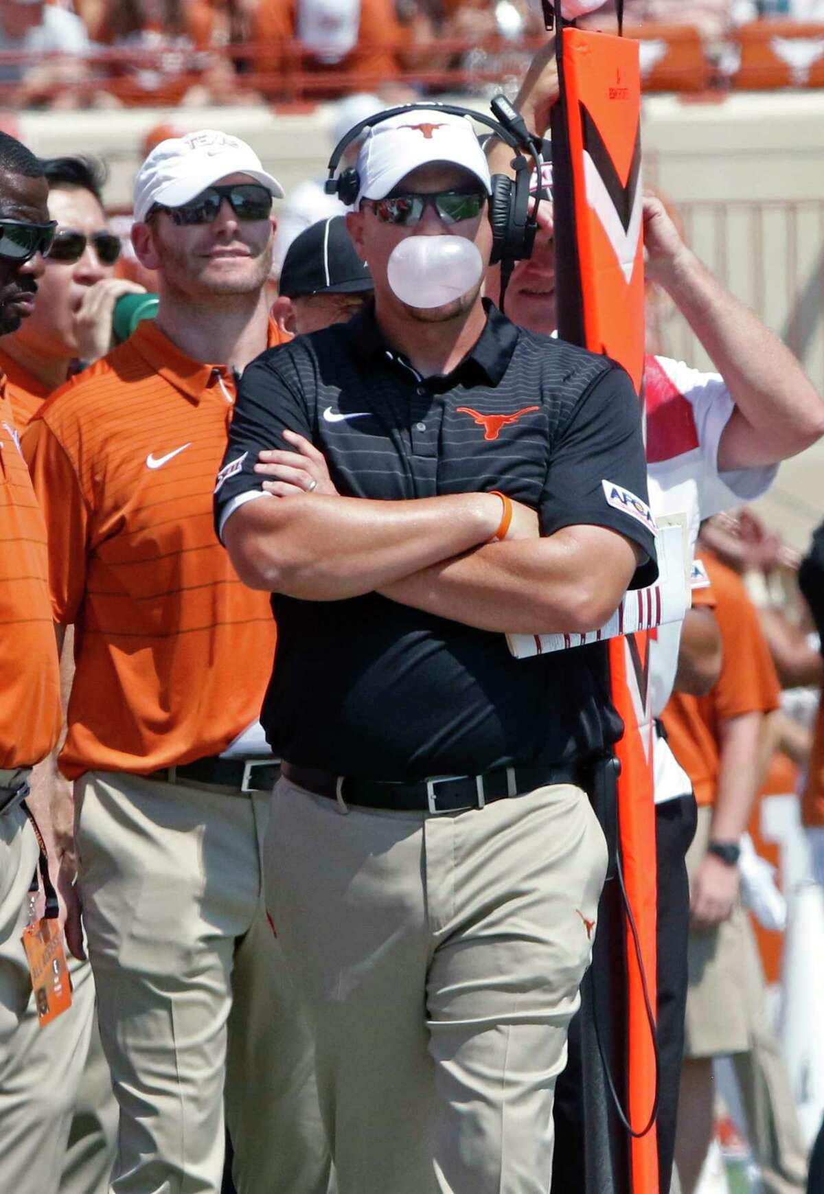 Texas head coach Tom Herman blows a bubble during the first half of an NCAA college football game against Maryland, Saturday, Sept. 2, 2017, in Austin, Texas. Maryland won 51-41. (AP Photo/Michael Thomas)