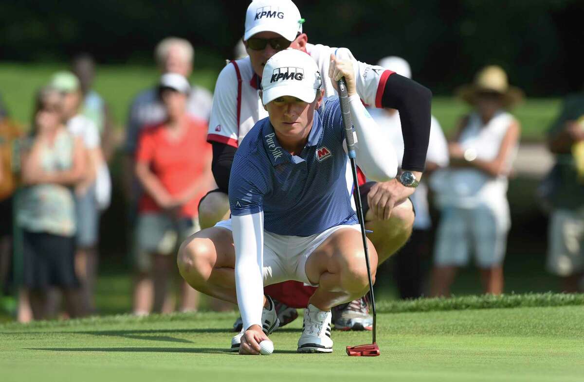 Stacy Lewis lines up her putt on the third hole during the final round of the Cambia Portland Classic golf tournament in Portland, Ore., Sunday, Sept. 3, 2017. (AP Photo/Steve Dykes)