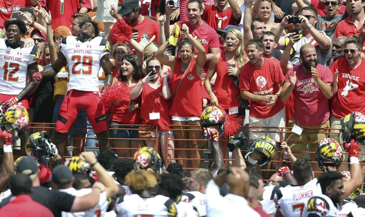 Terps fans celebrate after a 51-41 win as Texas hosts Maryland at DKR Stadium on September 2, 2017.