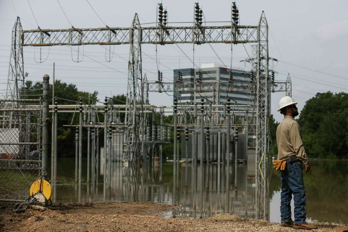 CenterPoint Energy lineman Jeff Faulkner stands near a flooded substation that crews are working to bring back online to restore power to affected customers Sunday, Sept. 3, 2017 in Houston. ( Michael Ciaglo / Houston Chronicle)
