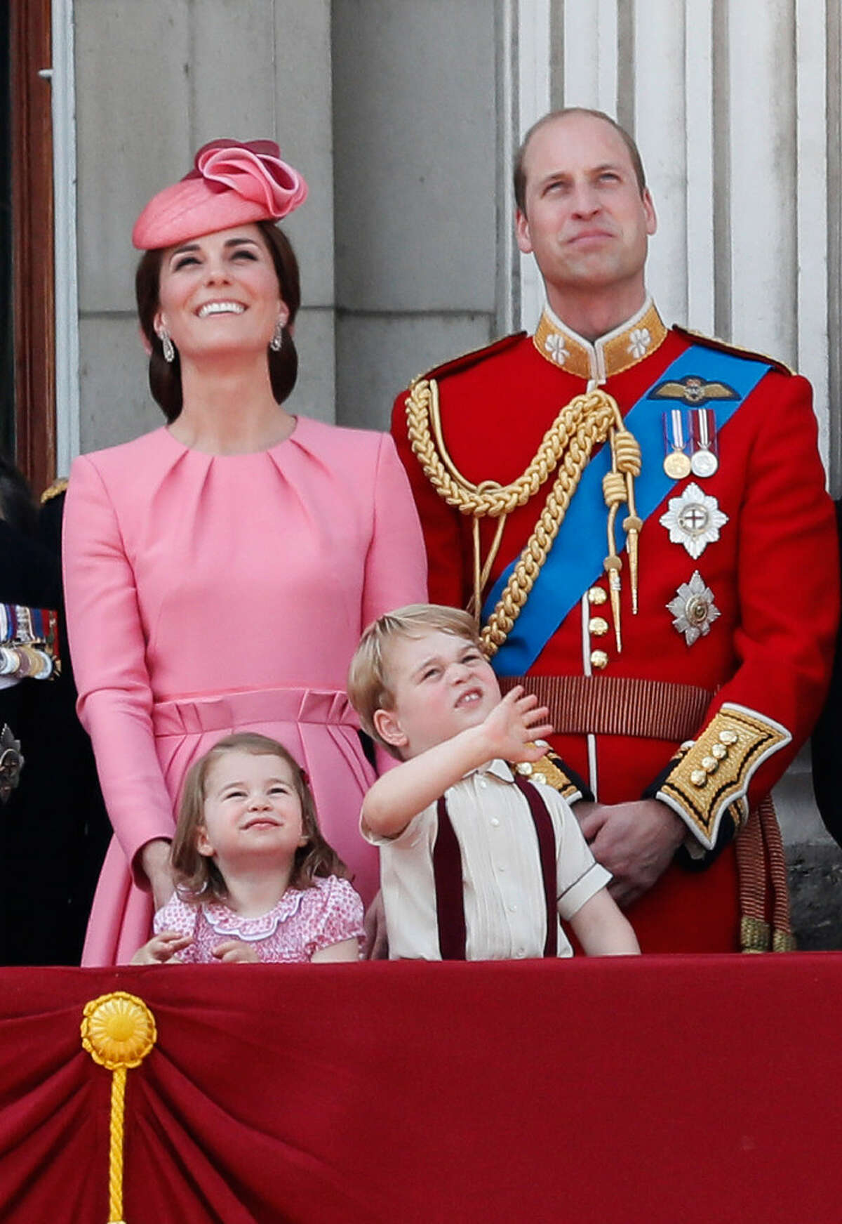 FILE - In this Saturday, June 17, 2017 file photo Britain's Kate, The Duchess of Cambridge, Prince William and their children Princess Charlotte and Prince George appear on the balcony of Buckingham Palace, after attending the annual Trooping the Colour Ceremony in London. Kensington Palace says Prince William and his wife, the Duchess of Cambridge, are expecting their third child. The announcement released in a statement Monday Sept. 4, 2017 says the queen is delighted by the news. (AP Photo/Kirsty Wigglesworth, File) ORG XMIT: TH103