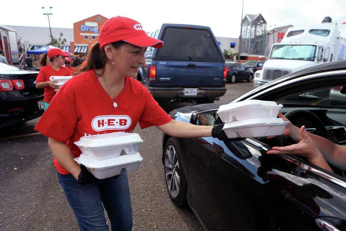 H-E-B employee Michelle Aquas distributes meals to Aransas Pass residents from H-E-B's Disaster Response Unit on Tuesday, Aug. 29, 2017, in Rockport, Texas.