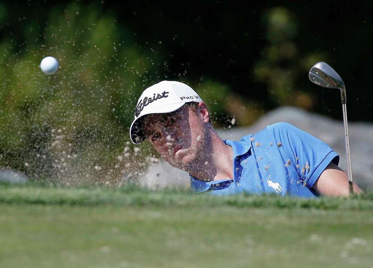 Justin Thomas hits out of a bunker on the third green during the final round of the Dell Technologies Championship golf tournament at TPC Boston in Norton, Mass., Monday, Sept. 4, 2017. (AP Photo/Michael Dwyer)