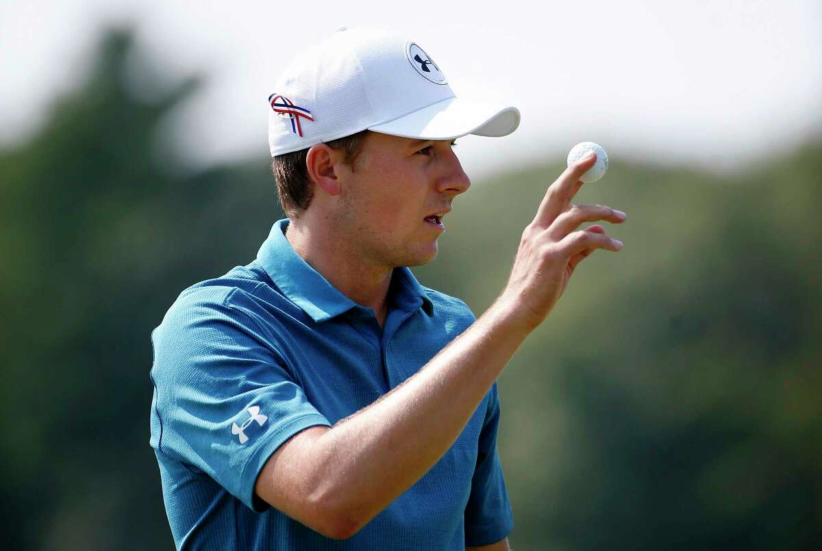 Jordan Spieth acknowledges the crowd after putting on the second hole during the final round of the Dell Technologies Championship golf tournament at TPC Boston in Norton, Mass., Monday, Sept. 4, 2017. (AP Photo/Michael Dwyer)