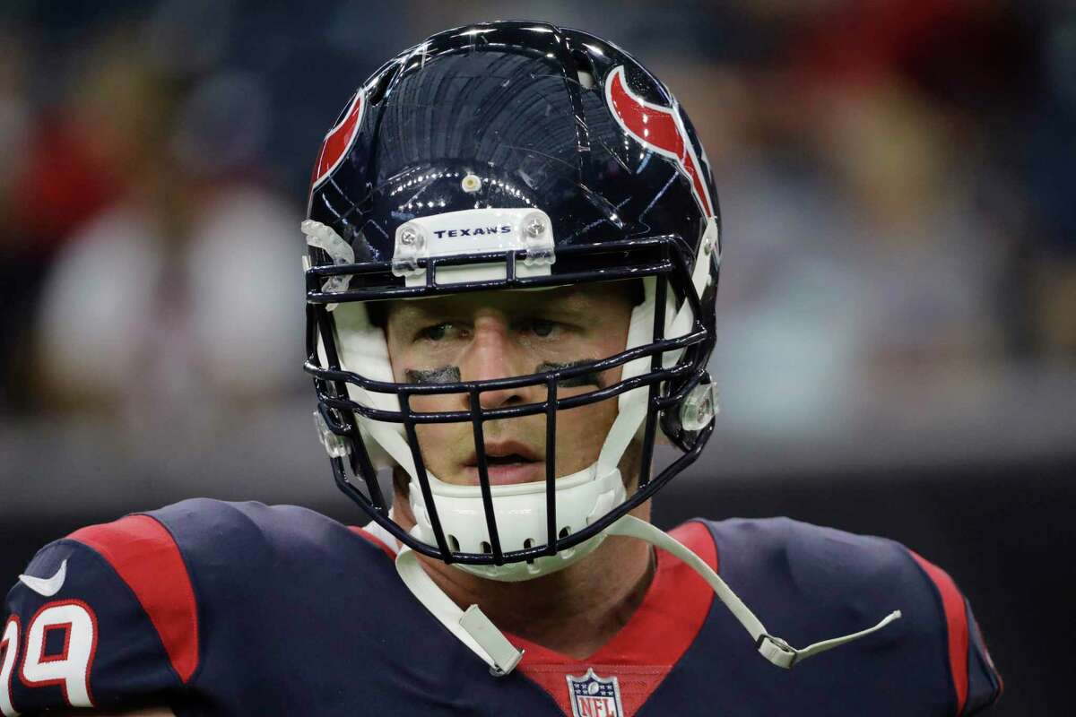 Houston Texans defensive end J.J. Watt warms up before an NFL football preseason game against the New England Patriots, in Houston. The Texans play their first game of the season on Sept. 10 against Jacksonville.