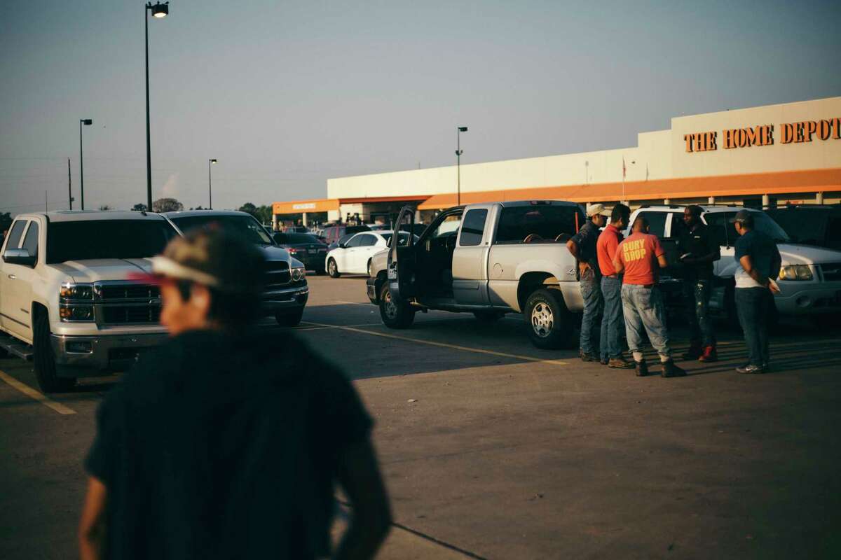 Day laborers seek work in a Home Depot parking lot in southwestern Houston on Saturday as the region starts to recovery from Hurricane Harvey.