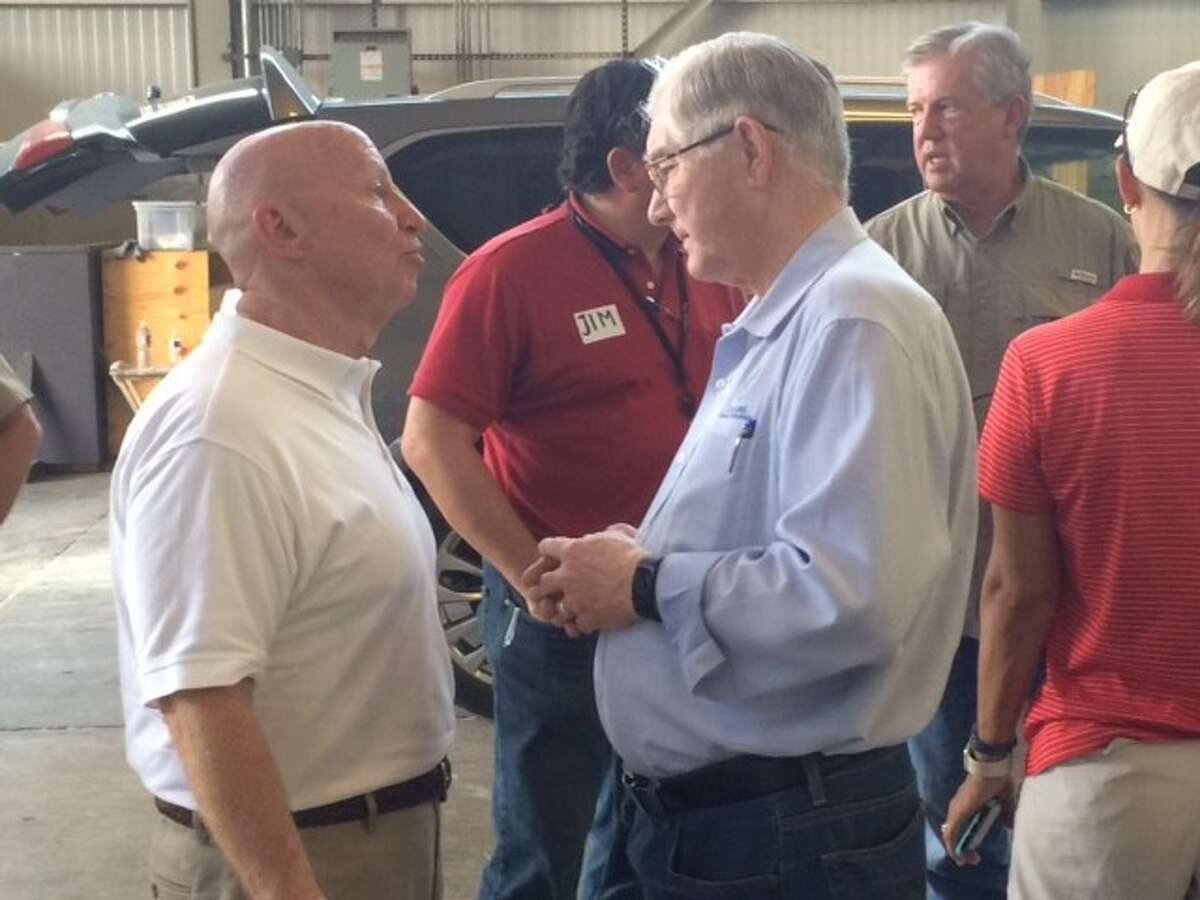U.S. Rep. Kevin Brady and Conroe Mayor Toby Powell discuss Harvey relief efforts at a distribution center in Conroe on Monday, Sept. 4.