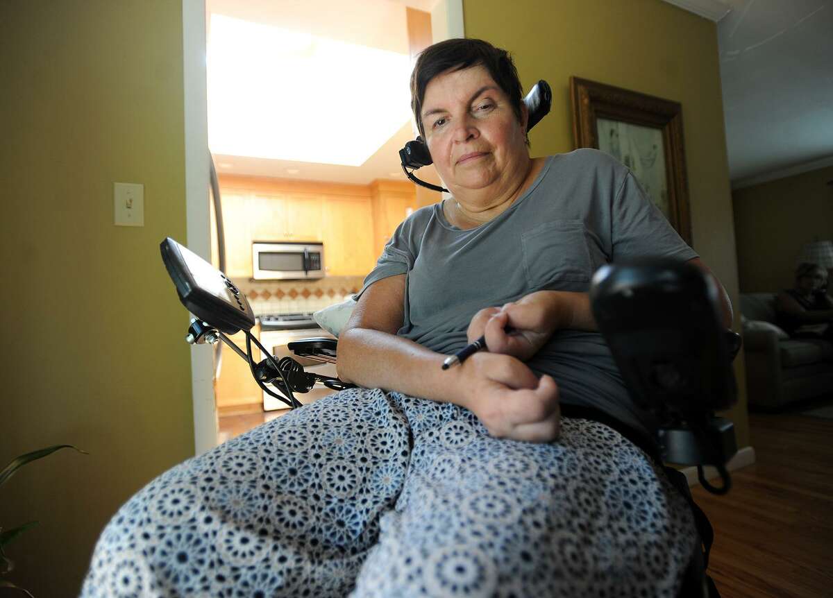 Carol Duffy, of Milford, who has multiple sclerosis, could lose her home health visits from Visiting Nurse Services of Connecticut following the governor's Executive Order to reduce payments to seven Medicaid home health care providers.