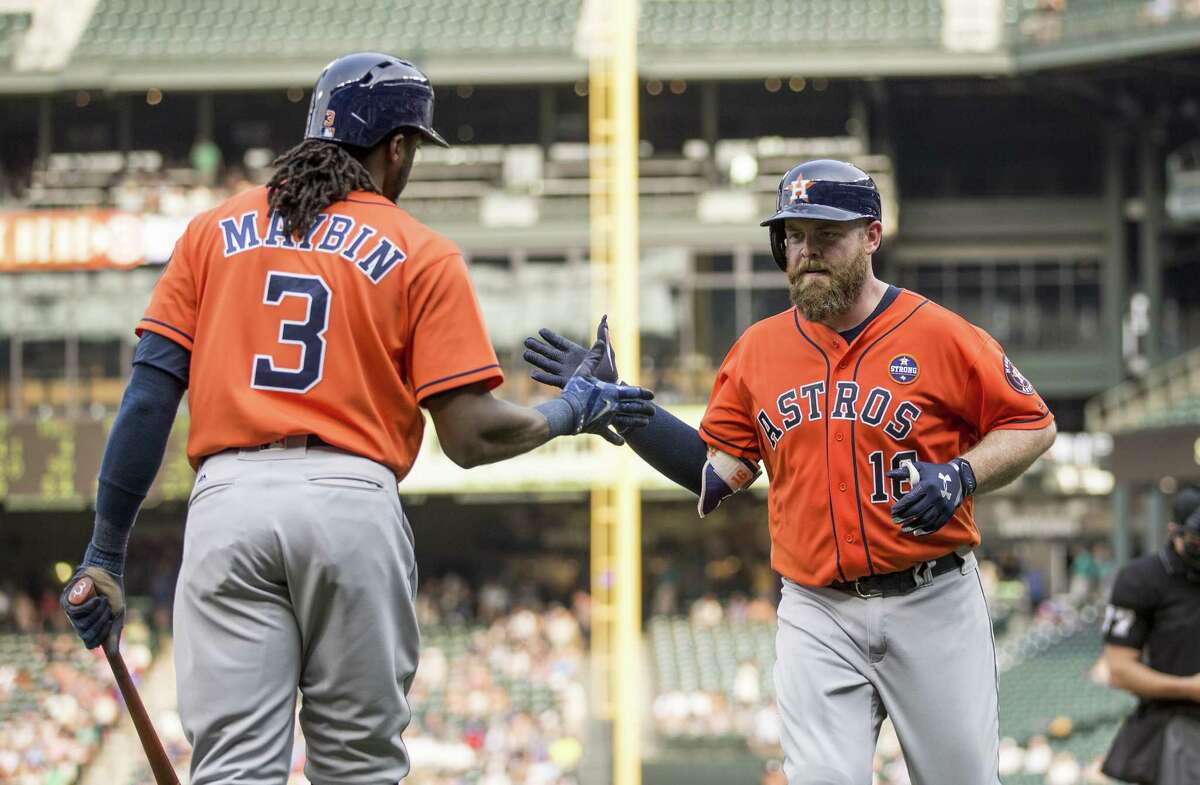 SEATTLE, WA - SEPTEMBER 4: Brian McCann #16 of the Houston Astros is congratulated by Cameron Maybin #3 of the Houston Astros after hitting a home run off of starting pitcher Erasmo Ramirez #31 of the Seattle Mariners during the fifth inning of a game at Safeco Field on September 4, 2017 in Seattle, Washington. (Photo by Stephen Brashear/Getty Images)