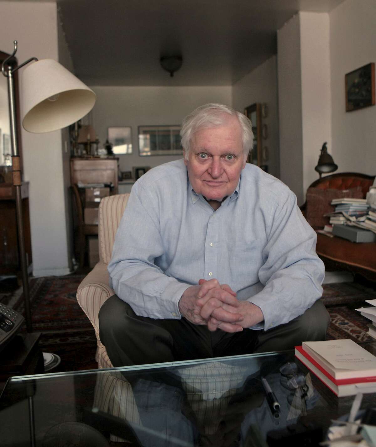 FILE - In this Sept. 29, 2008, file photo, Poet John Ashbery interviewed at his apartment in New York. Ashbery, widely regarded as one of the world's greatest poets, died Sunday, Sept. 3, 2017, at home in Hudson, New York, of natural causes, according to husband, David Kermani. He was 90. (AP Photo/Bebeto Matthews, File)