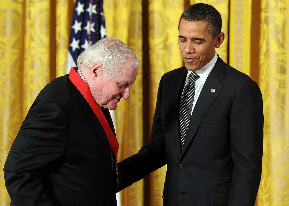 (FILES): This file photo taken on February 13, 2012 shows US President Barack Obama presenting the 2011 National Arts and Humanities Medal to poet John Ashbery during a ceremony in the East Room at the White House in Washington, DC. Pulitzer-prize winning poet John Ashbery, a post-modern American trailblazer, has died at age 90 in Hudson, New York, his family told US media Sunday, September 3, 2017. The experimental vanguardist was sometimes accused of writing poems that were at times less than accessible to a wider audience. Ashbery, who said he felt influenced by John Yeats, studied at Columbia University. The Rochester, New York native loved to mix everyday language and thoughts with elevated language. / AFP PHOTO / JEWEL SAMADJEWEL SAMAD/AFP/Getty Images
