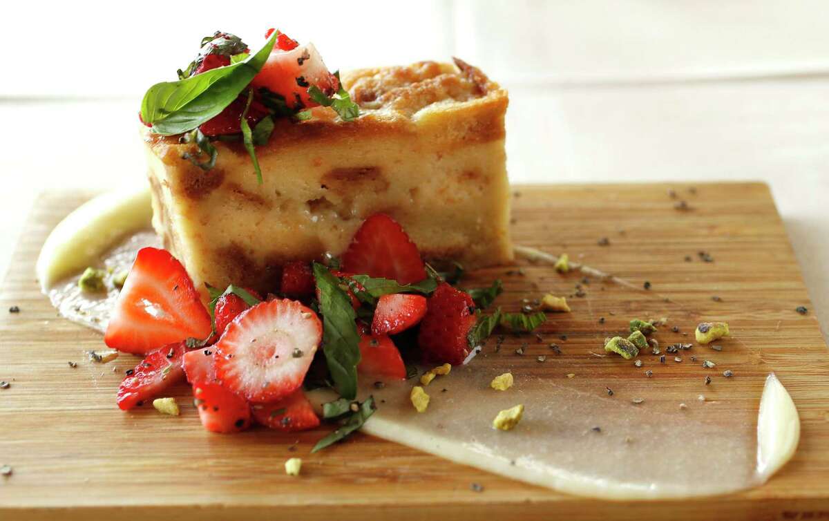 White chocolate bread pudding with yuzu curd, Thai basil and pepper strawberries at Roost