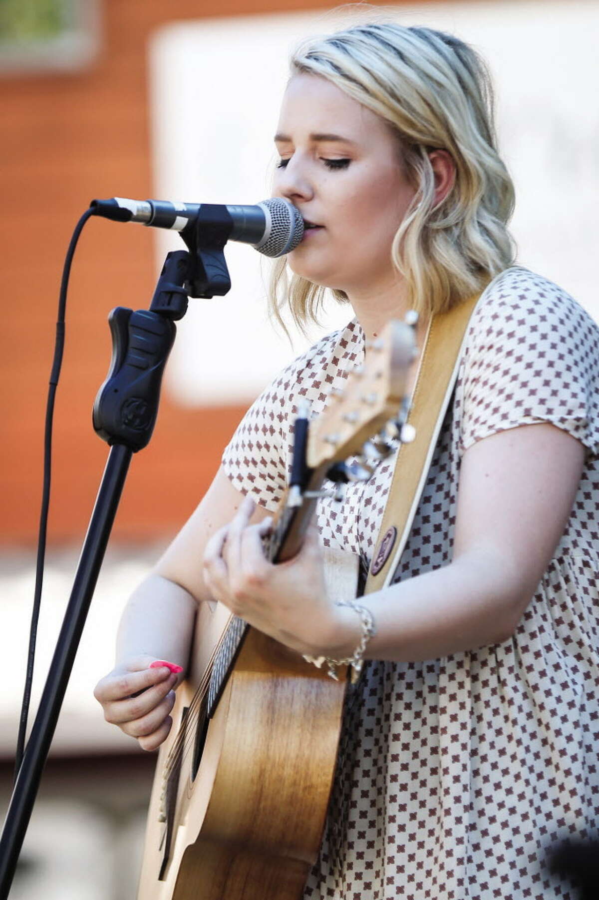 Abbey Hirvela, originally from Montgomery but now living and working in Nashville, performs during the Historic Montgomery Wine & Music Fest on Saturday, Sept. 17, 2016, in downtown Montgomery.