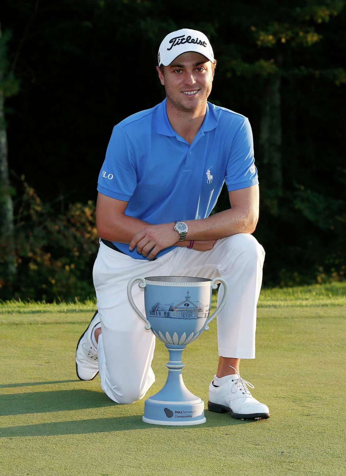 Justin Thomas poses with the trophy after winning the Dell Technologies Championship golf tournament at TPC Boston in Norton, Mass., Monday, Sept. 4, 2017. (AP Photo/Michael Dwyer)