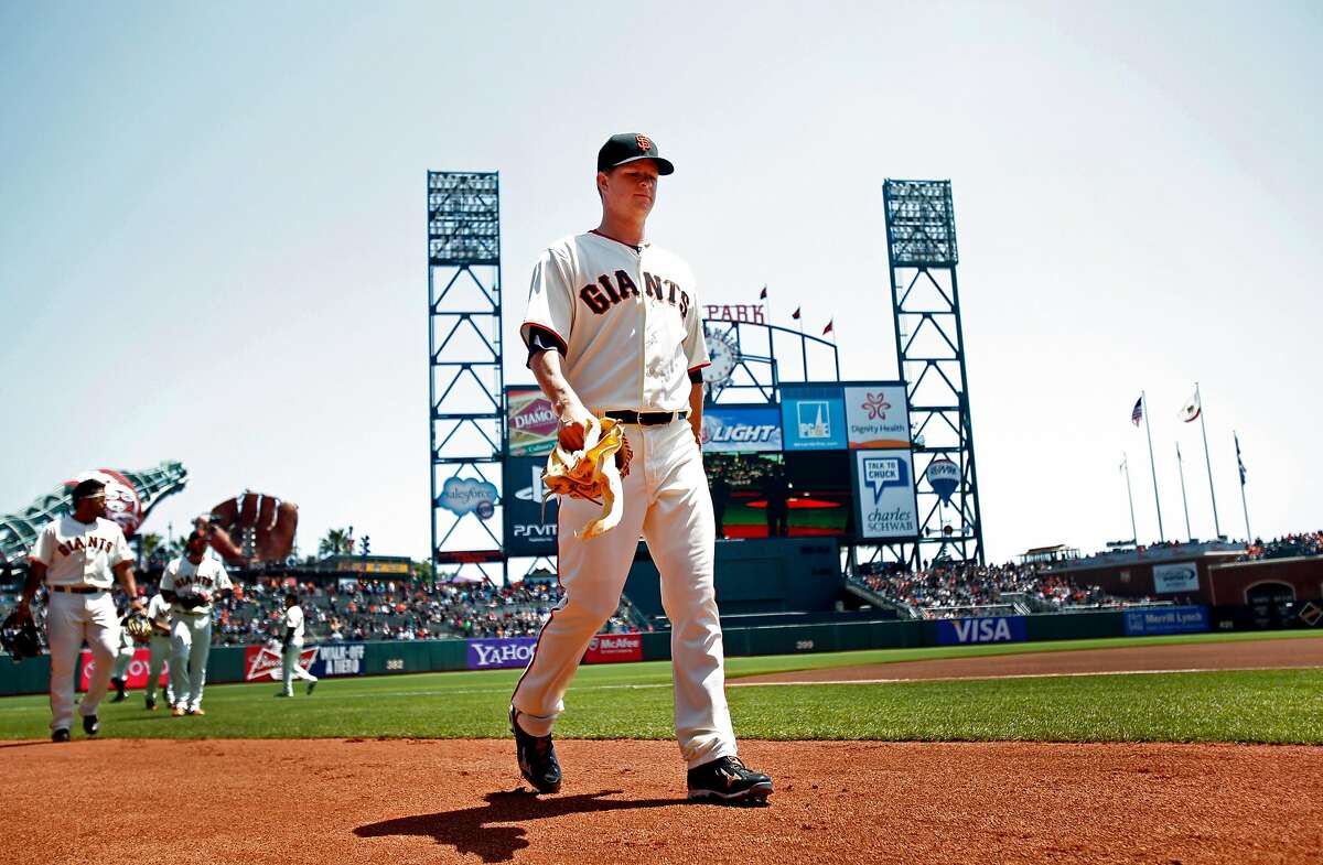 Matt Cain comes off the field after warming up.