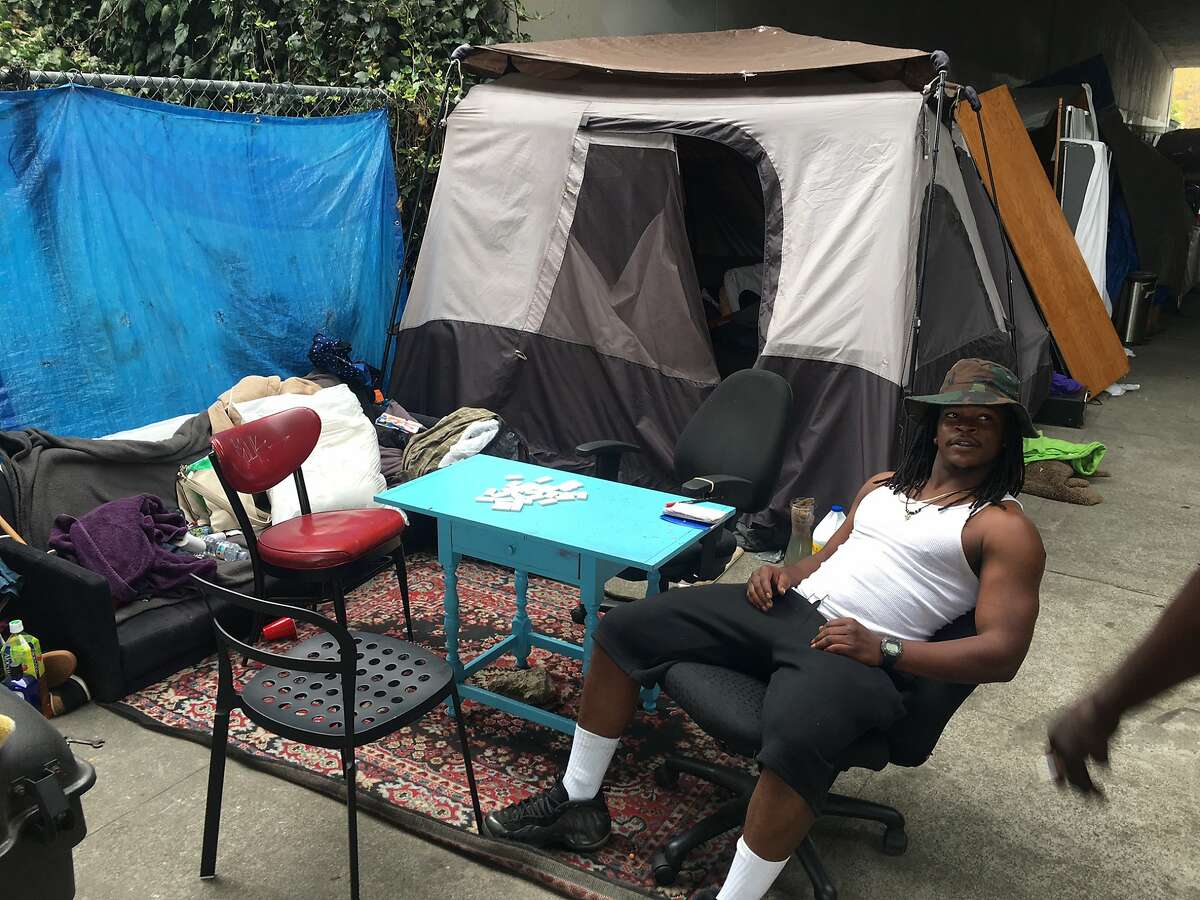 Just a week after Oakland cleared homeless encampments on 29th and 30th streets because the sidewalks on both sides of the street were blocked one of the cardinal rules of a camp just a few blocks away is that the sidewalk must be passable. Vernon Pierce, 24, helps enforce the camp rules.