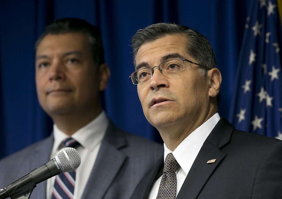 California Attorney General Xavier Becerra, right, flanked by Secretary of State Alex Padilla, discusses the lawsuit he intends to file against the Trump administration over the cancelation of the Deferred Action for Childhood Arrivals program, during a news conference, Tuesday, Sept. 5, 2017, in Sacramento, Calif. (AP Photo/Rich Pedroncelli)