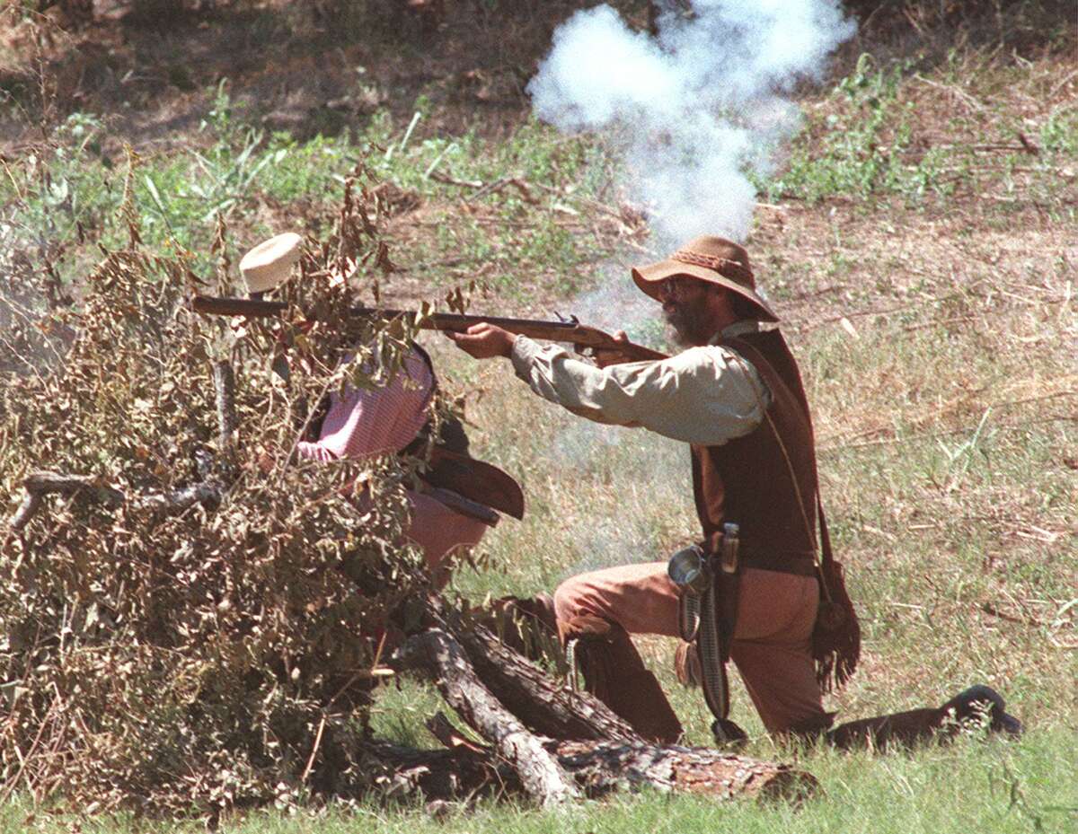 Members of the San Antonio Living History Association dressed as the Texian Troops of Jack Hays fire on Mexican troops of Gen. Adrián Woll in a re-enactment of the Battle of Salado Creek, the last inland invasion of Texas on Sept. 11, 1842. The 1999 re-enactment took place at Victoria’s Black Swan Inn on the Salado Creek, the original battleground.