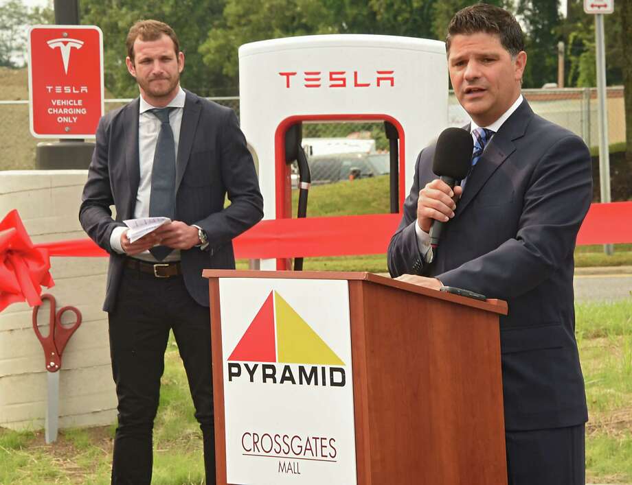 New York State Senator George Amedore speaks during a ribbon cutting ceremony at for the largest Supercharger in the Northeast at Crossgates Mall on Tuesday, Sept. 5, 2017 in Guilderland, N.Y. Senator Amedore and others addressed the economic benefits of Tesla's investment in the Capital Region and the environmental benefits of expanding New Yorkers' access to zero-emissions vehicles. Will Nichols, senior policy manager for Tesla, listens at left. (Lori Van Buren / Times Union) Photo: Lori Van Buren / 20041432A
