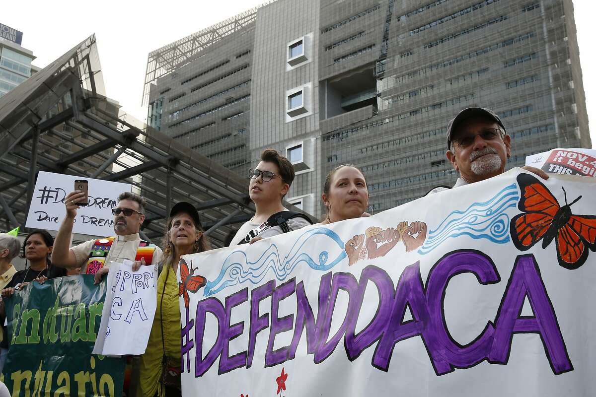 People protest outside the San Francisco Federal Building on Tuesday, Sept. 5, 2017, in San Francisco, Calif. Demonstrators rallied in support of the Deferred Action for Childhood Arrivals (DACA) program, which the Trump administration said will phase out in six months.