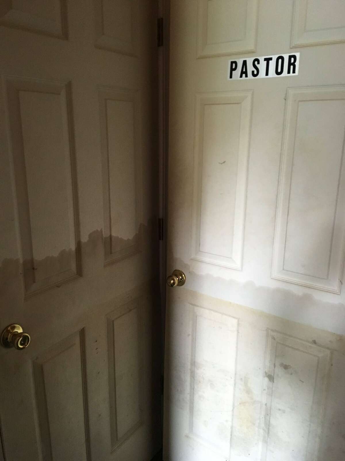 Doors inside Oak Grove Baptist Church in North Beaumont show how high floodwaters rose inside.