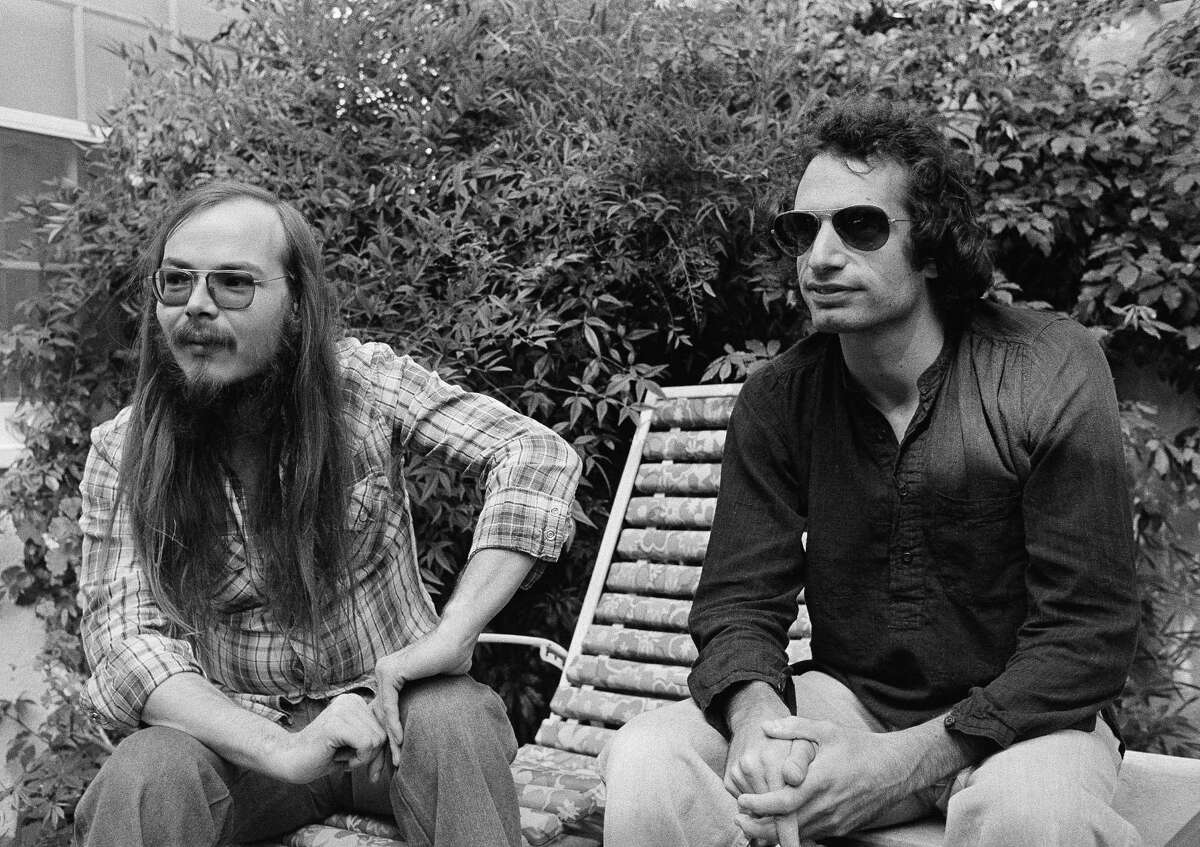 In this Oct. 29, 1977, file photo, Walter Becker, left, and Donald Fagen of Steely Dan, sit in Los Angeles. Becker, the guitarist, bassist and co-founder of the rock group Steely Dan, died two years ago but Fagen continues to tour with the band. The band was expected to play at the Saratoga Performing Arts Center this summer but the show was moved to next year amid the coronavirus pandemic. .(AP Photo/Nick Ut, File)