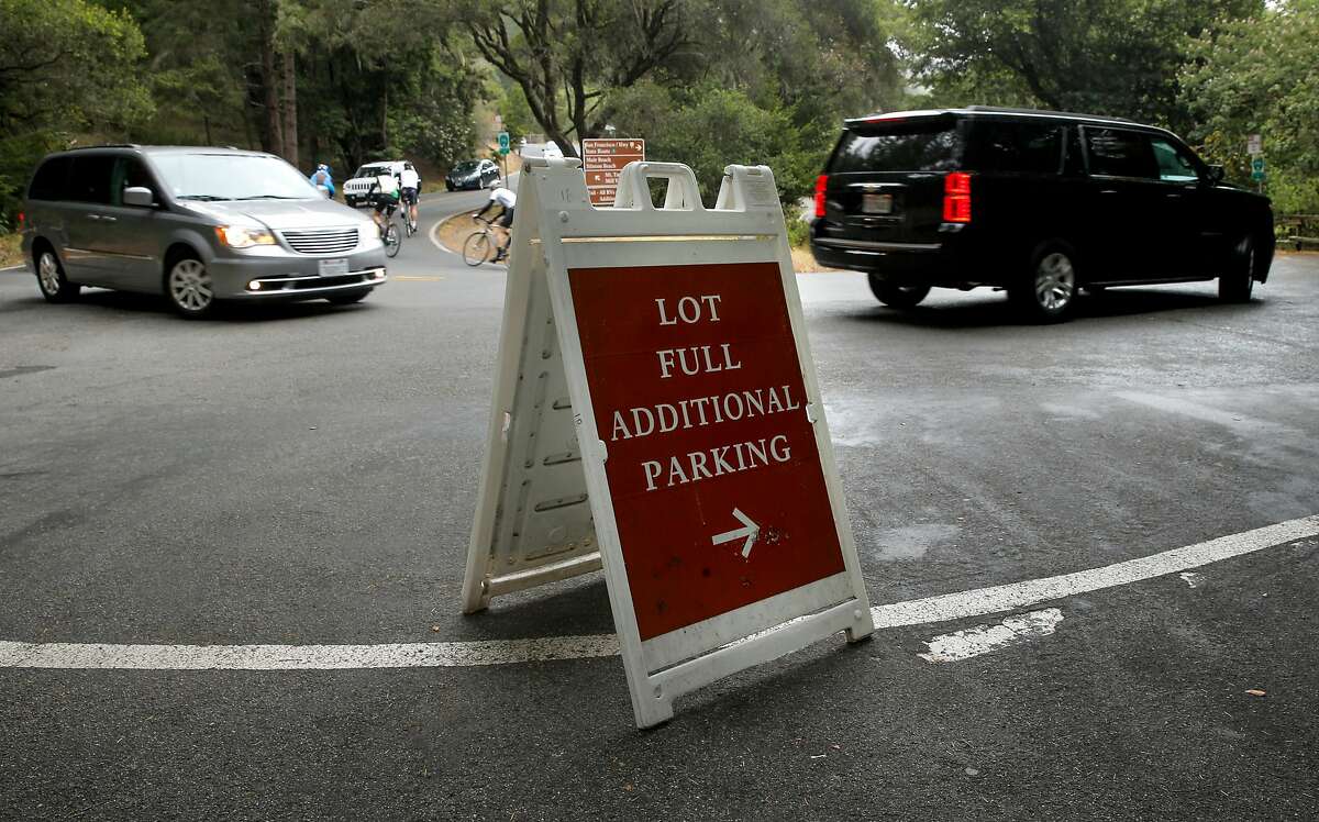 With the main parking lots filling up early, visitors must search for parking along the shoulder of Muir Woods road at Muir Woods National Park, in Mill Valley, Calif., as seen on Thurs. July 9, 2015,