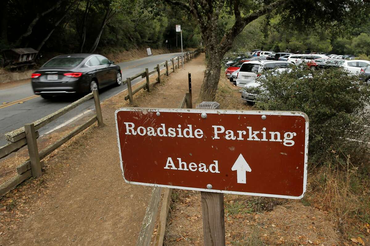 With the main parking lots full visitors must search for parking along Muir Woods road at Muir Woods National Park, in Mill Valley, Calif., as seen on Thurs. July 9, 2015,