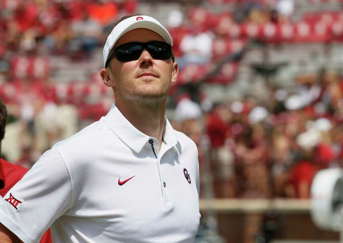 In this Saturday, Sept. 2, 2017, photo, Oklahoma head coach Lincoln Riley looks out at the stands before an NCAA college football game against UTEP in Norman, Okla. Riley is just 33 years old, and the schedule doesn't care. Two games into his head coaching career, he'll take the fifth-ranked Sooners into Columbus to face No. 2 Ohio State. (AP Photo/Sue Ogrocki)