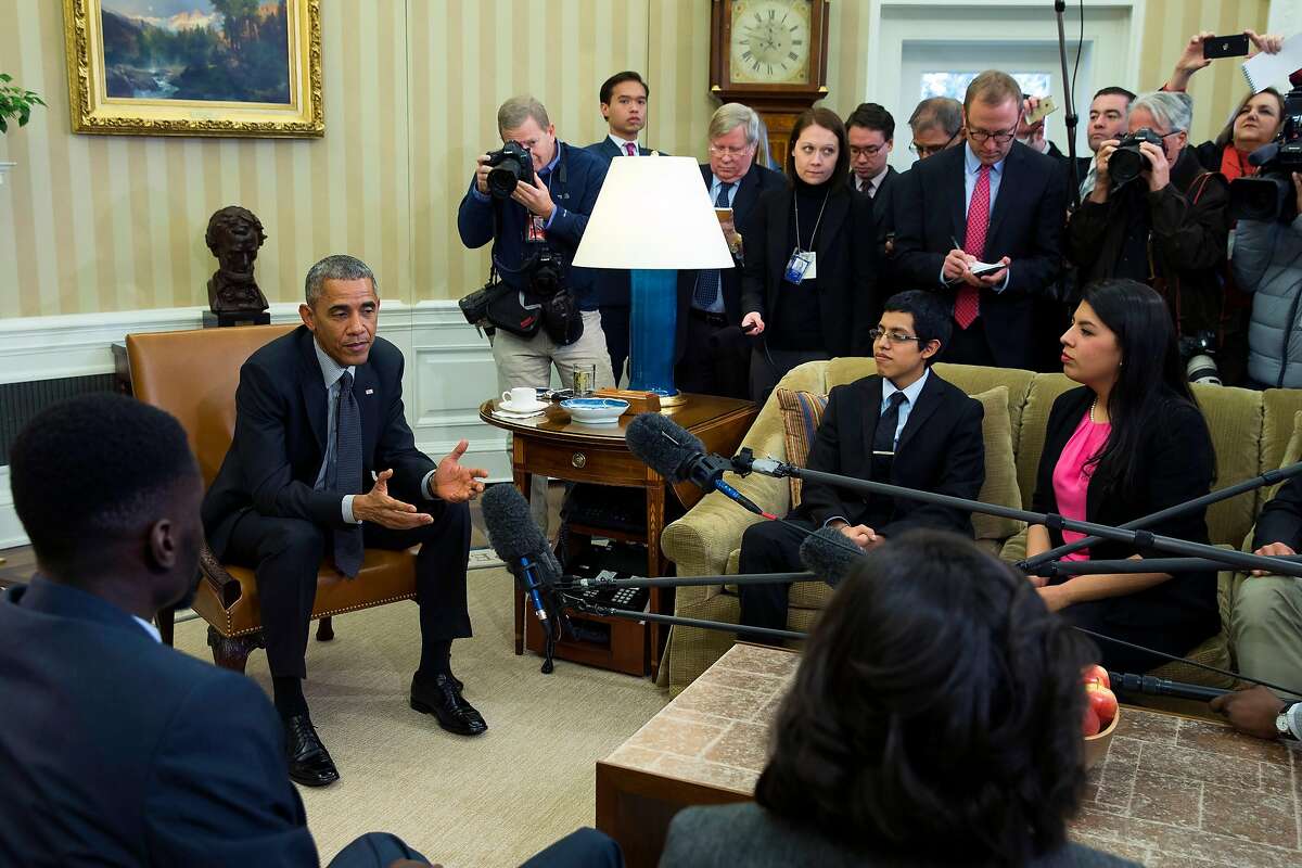 President Barack Obama meets with a group of "Dreamers" in the Oval Office of the White House in Washington, Wednesday, Feb. 4, 2015. The president is accusing opponents of his immigration action of failing to think about the "human consequences." The president spoke during an Oval Office meeting Wednesday with six of young immigrants who would be subject to eventual deportation under a bill passed by the House. The legislation would overturn Obama's executive actions limiting deportations for millions here illegally and giving them the ability to work. (AP Photo/Evan Vucci)