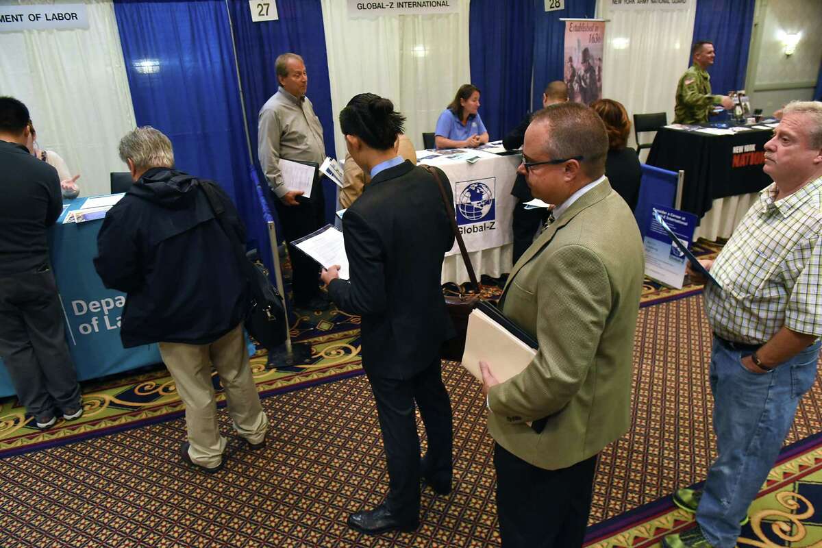 Job seekers line up to talk to a representative from the Department of Labor at the Times Union Technology & Manufacturing Job Fair at the Albany Marriott hotel on Wednesday, Sept. 6, 2017 in Colonie, N.Y. (Lori Van Buren / Times Union)