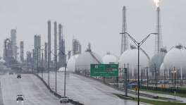 A flare is seen Aug. 29 at Shell's Deer Park refinery, where two tanks were damaged by the storm. Several plants shut down after Hurricane Harvey made landfall are coming back on line.