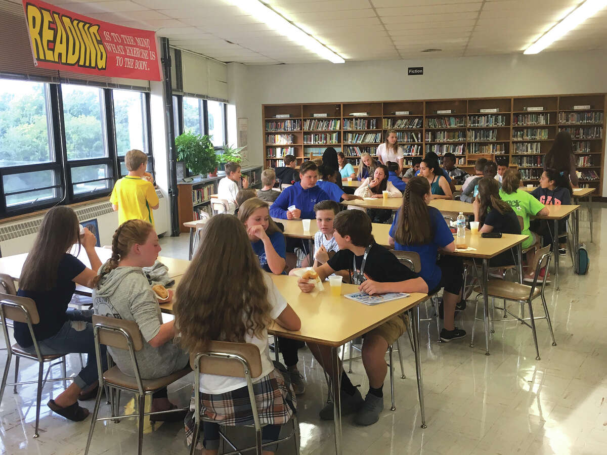 Students new this year to Lincoln Middle School gather in the library recently for a welcome breakfast.