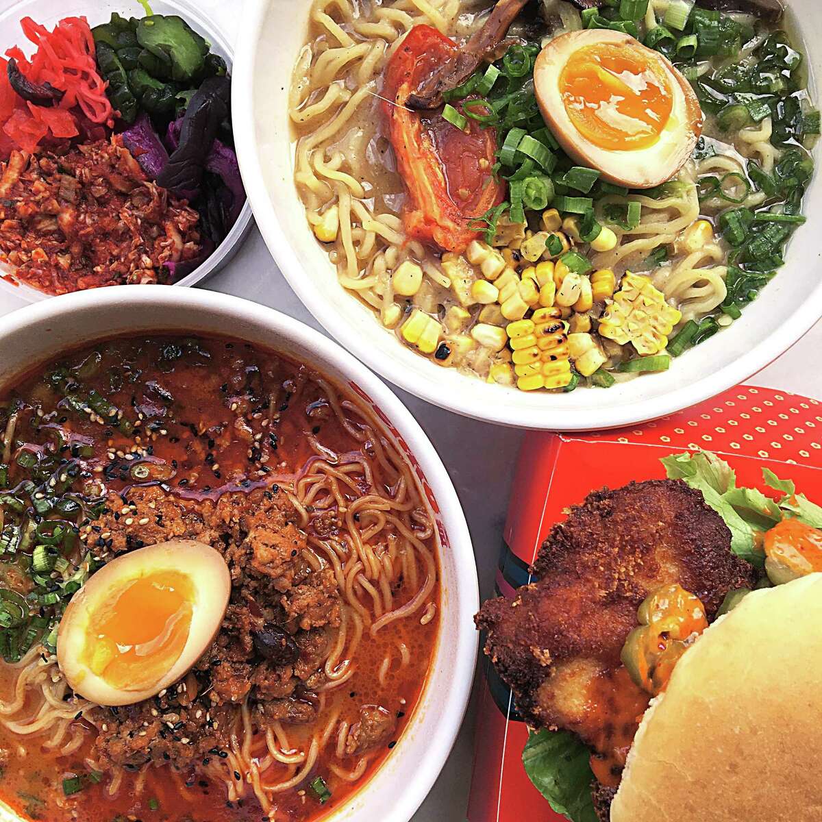 Food from Tenko Ramen at the Bottling Department food hall at The Pearl. Clockwise from top left: kimchi, Double Mushroom ramen, chicken katsu sandwich and Spicy Miso Tantan-men ramen.