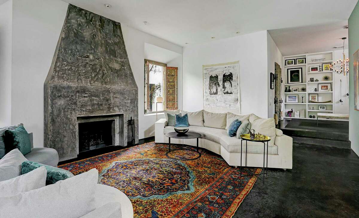 The Washington Heights home of Sicily Dickenson. Painting on the wall is by Houston artist Matt Messinger.