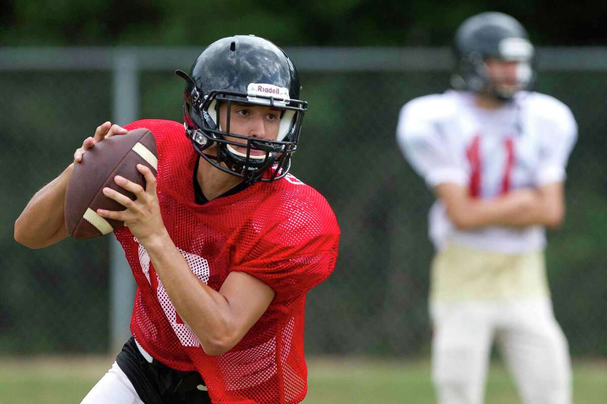 Canery Creek quarterback Julian Hernanadez looks to pass during football practice at Caney Creek High School, Wednesday, Aug. 16, 2017, in Conroe.