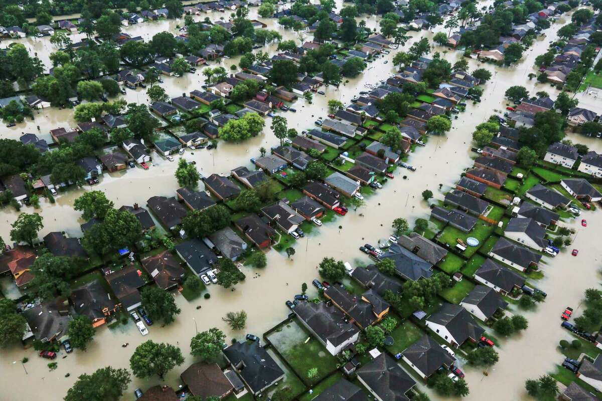 A neighborhood is inundated by floodwaters from Harvey near east Interstate 10 on Aug. 29 in Houston. ( Brett Coomer / Houston Chronicle )
