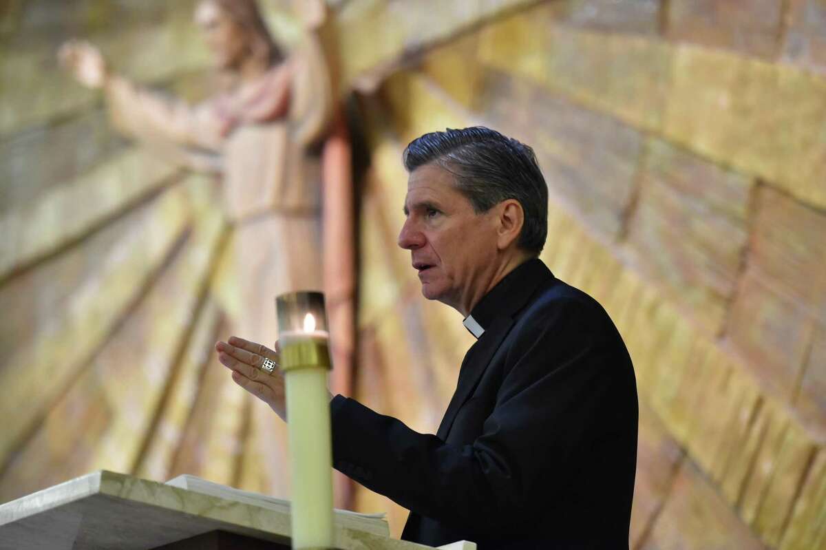 Archbishop Gustavo García-Siller speaks during Thursday’s Holy Hour of Prayer at St. Matthew Church.