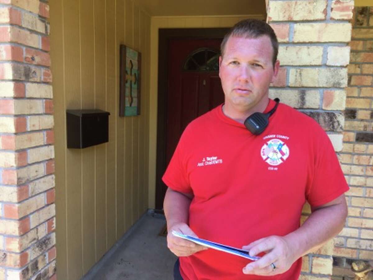 Joshua Taylor, a first responder with the Port Arthur Fire Department, stands outside his home on his first day off since Aug. 24.
