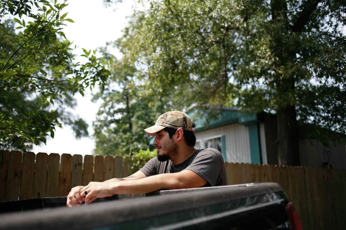 Avelino Justo, a DACA recipient, stands outside the flooded trailer home he recently purchased with his wife in Houston, Sept. 3, 2017.