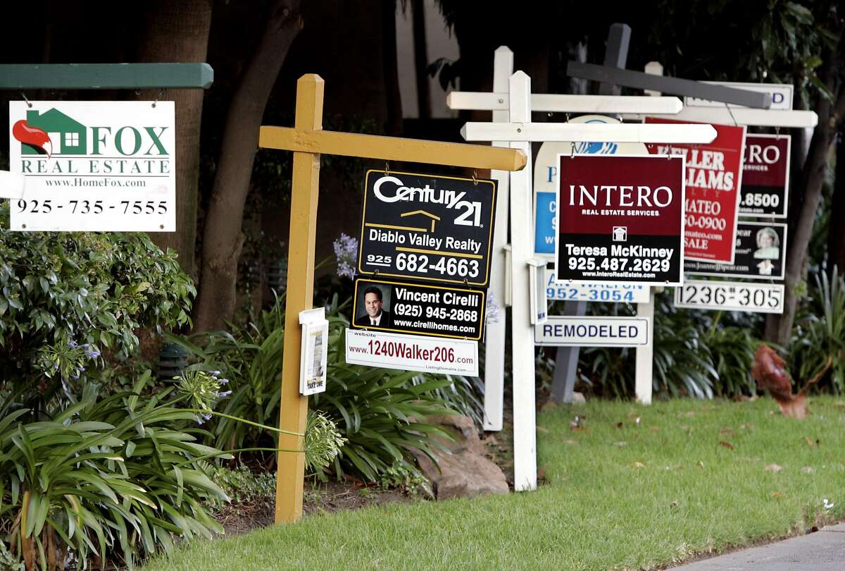 Real estate signs posted at a housing complex in Walnut Creek, Calif., Saturday, Aug. 5, 2006. Home sales kept falling in July in Northern California along with the appreciation rate of prices, a real estate research firm reported Wednesday. (AP Photo/Paul Sakuma)
