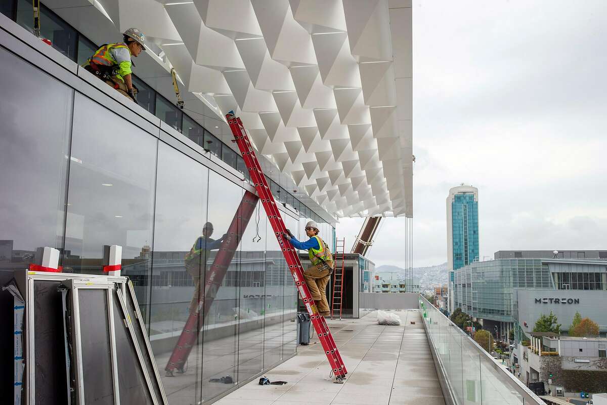 Workers continue construction of the Moscone Center South expansion on Thursday, Sept. 7, 2017, in San Francisco, Calif.