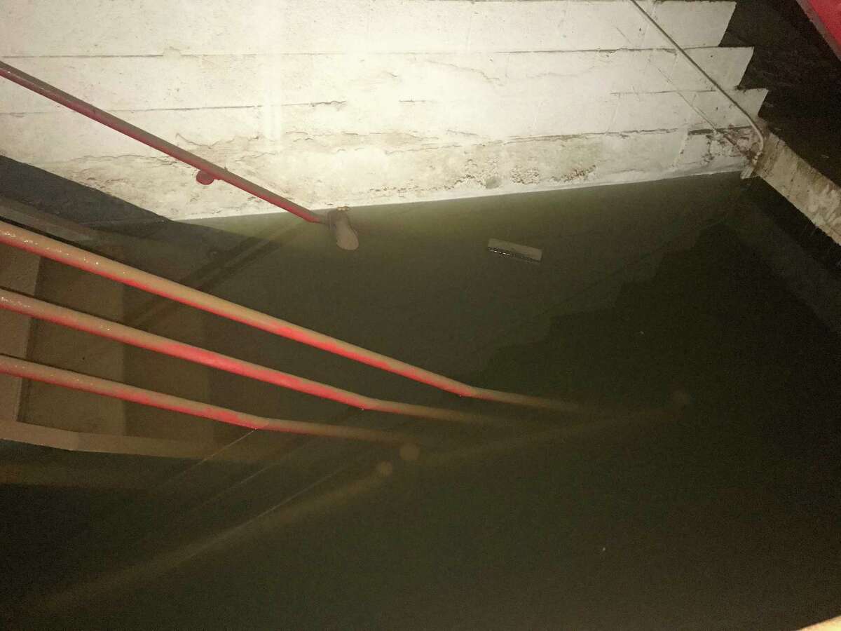 Flooded stairs in the parking garage owned by Houston First in the Theater District