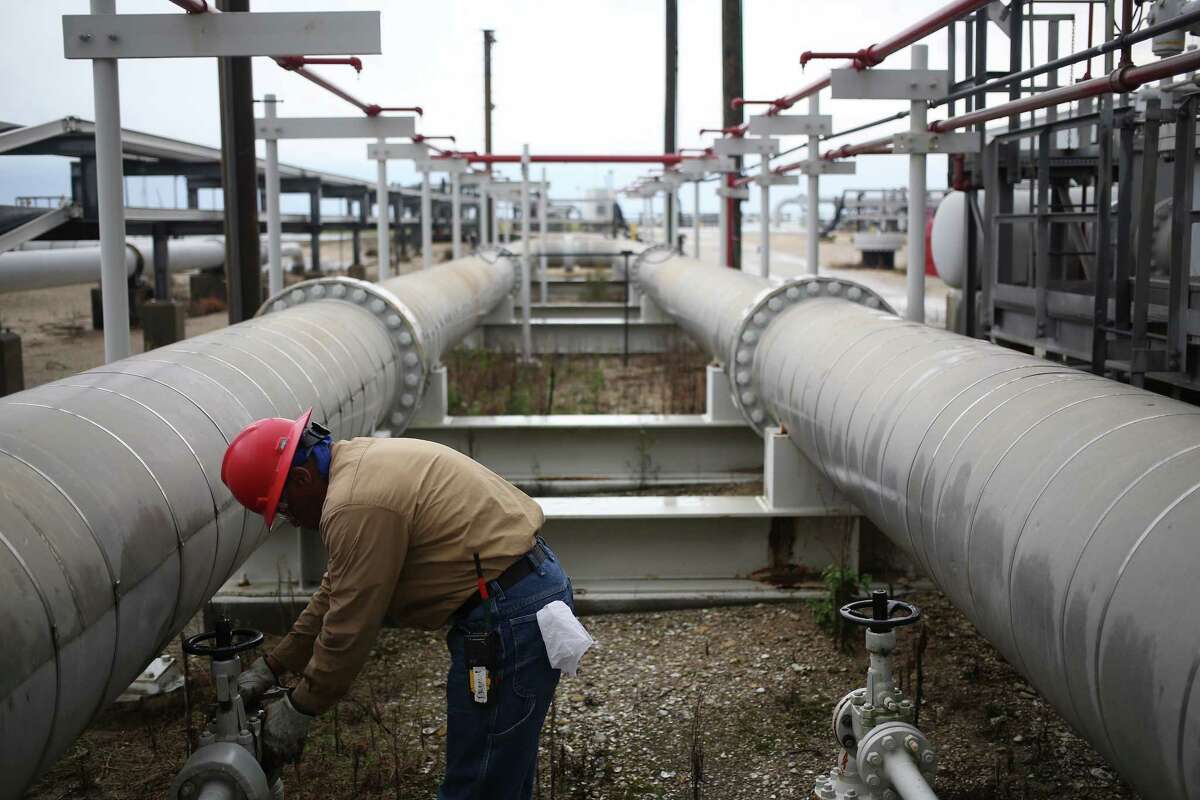 A contractor works on the infrastructure last year at the U.S. Department of Energy's Bryan Mound Strategic Petroleum Reserve in Freeport. The U.S. has about 675 million barrels of oil in the reserve, which is stored in four salt caverns in Texas and Louisiana. ﻿